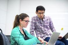 students looking at laptop