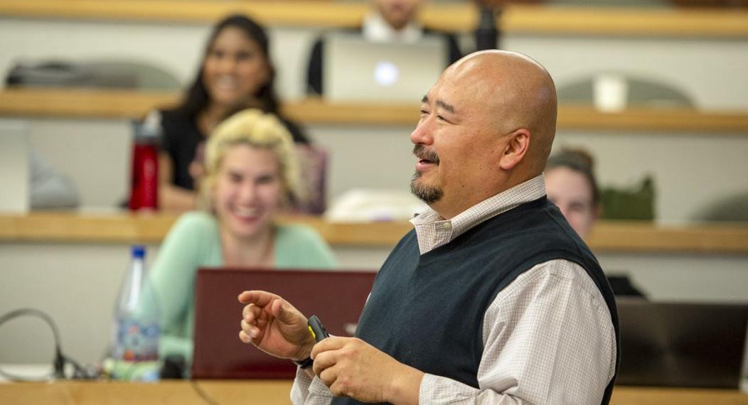 A professor addresses a classroom