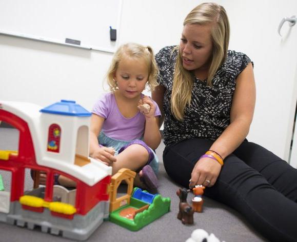 student working with child